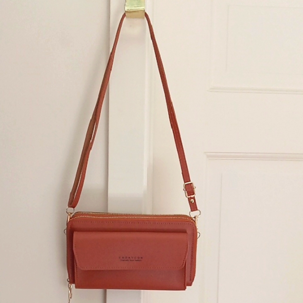 NEW.  TAN MULTI-COMPARTMENT CROSSBODY BAG. - 8" L X 4 1/2" H X 2 1/2" W.